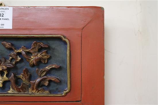 A Chinese gilt and red lacquered relief panel 84 x 32cm
